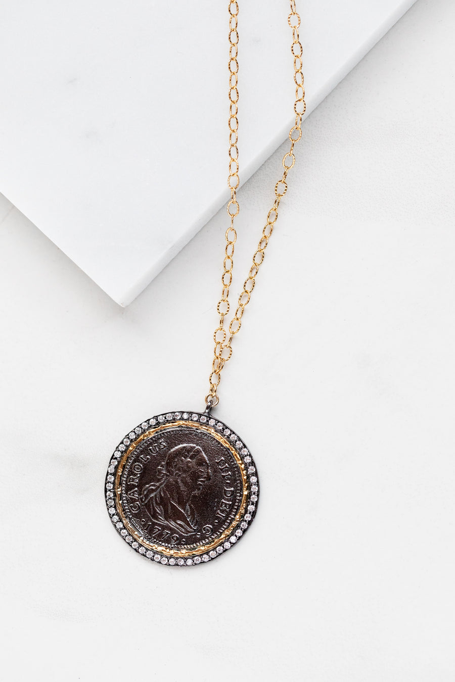 Find the perfect necklace you're looking for from Charme Silkiner! This beautiful 14K Gold Filled Chain Necklace with black stamped coin pendant and CZ pave accents is perfection. Great for layering or wearing alone the Easton Necklace is the perfect piece of unique jewelry that everyone should own.