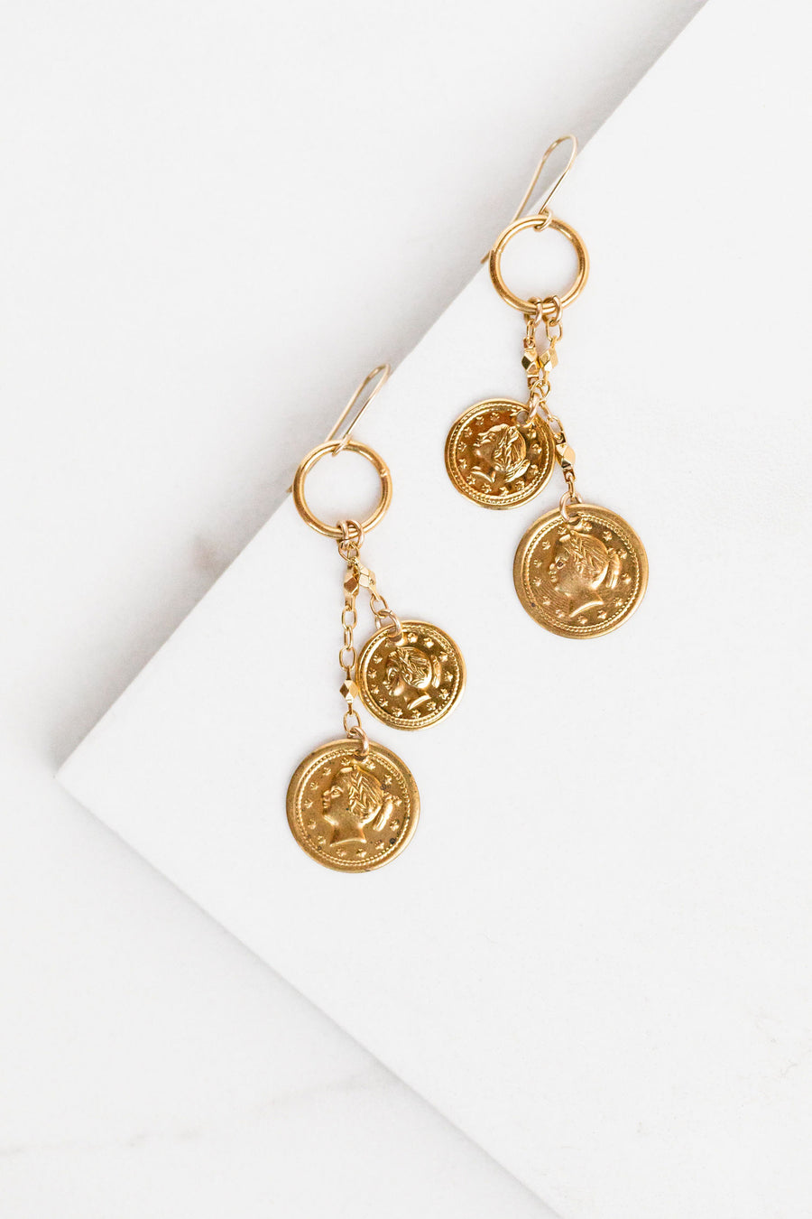 Find the perfect pair of earrings you're looking for from Charme Silkiner! These 14k Gold Hoop Earrings with Gold Coin Accents are seriously stunning. Perfect to dress or dress down any outfit the Chiraz Earrings are the perfect must have for everyone!