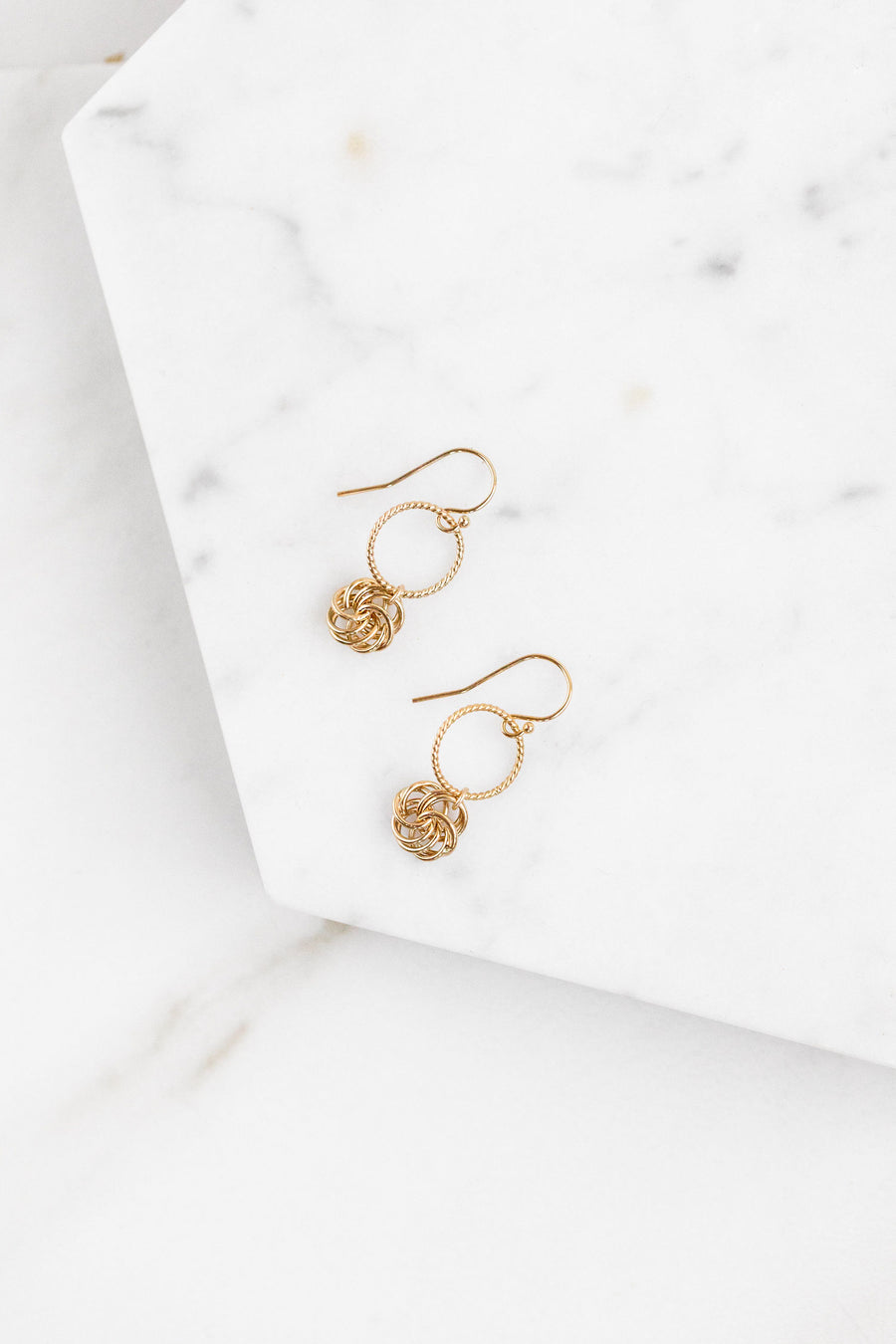 Find the perfect pair of earrings you're looking for from Charme Silkiner! These 14k gold hoop earring with a flower detail charm is seriously stunning. Perfect to dress or dress down any outfit the Malina Earrings are the perfect must have for everyone!