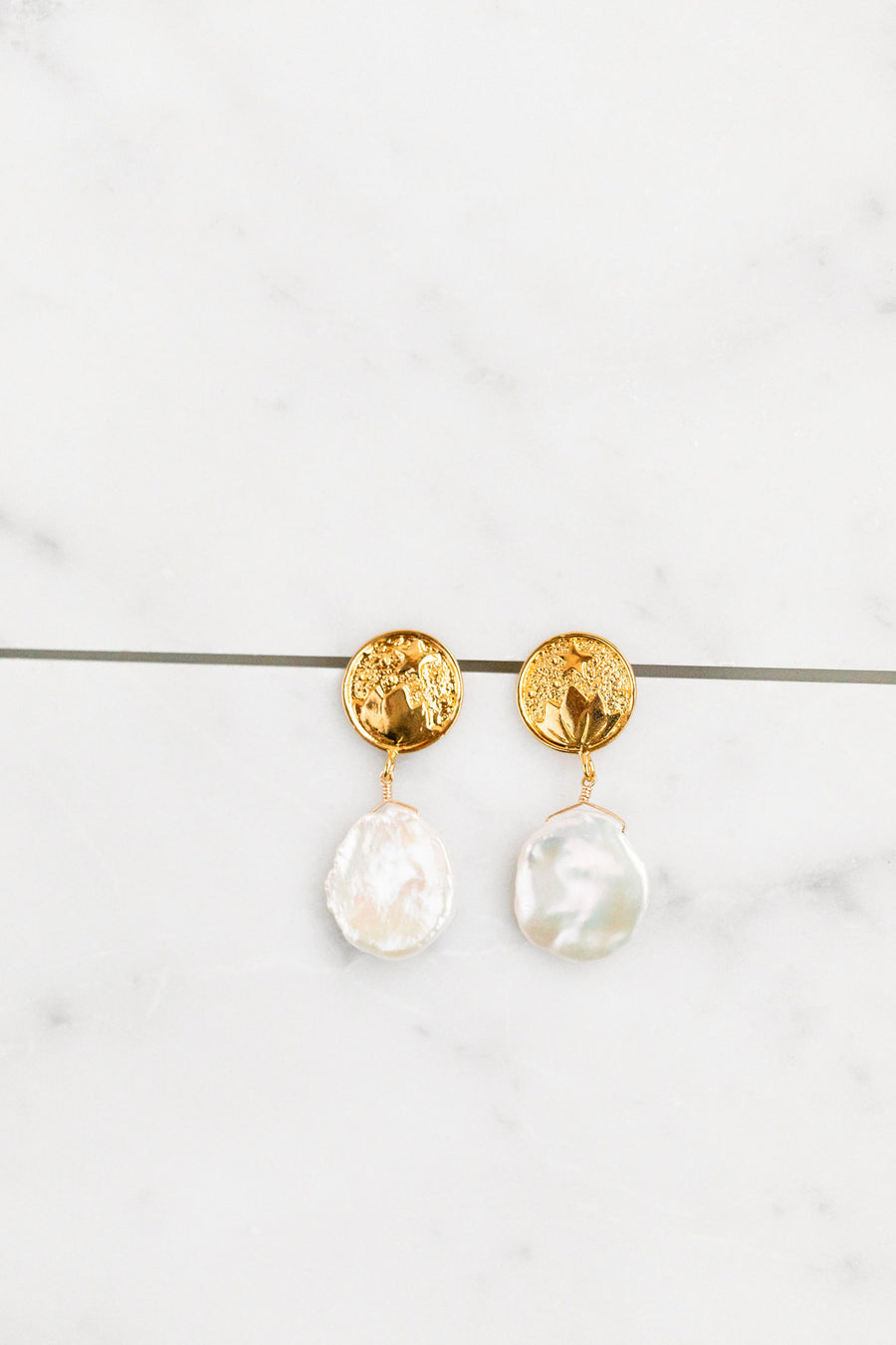 Find the perfect pair of earrings you're looking for from Charme Silkiner! These 14k gold + pearl drop earrings are seriously eye-catching and stunning. Perfect to dress or dress down any outfit the Ravel Earrings are the perfect must have for everyone!