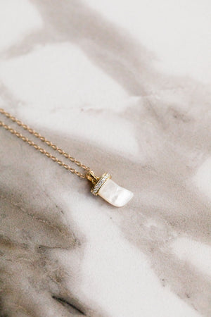 Find the perfect necklace you're looking for from Charme Silkiner! This beautiful 14K Gold Chain Necklace with Mother of Pearl Horn and CZ Accents is pure perfection. Great for layering or wearing alone the Haze Necklace is the perfect piece of unique jewelry that everyone should own.