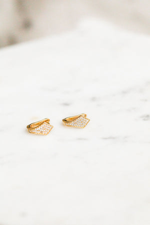 Find the perfect pair of earrings you're looking for from Charme Silkiner! These 14k gold filled earrings with cz pave huggies are seriously stunning. Perfect to dress or dress down any outfit the Avel Earrings are the perfect must have for everyone!