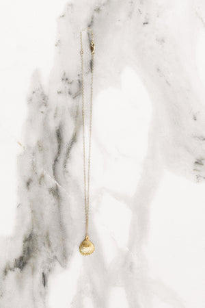 Find the perfect necklace you're looking for from Charme Silkiner! This beautiful 14K Gold Chain Necklace with a shell pendant is simply stunning. Great for layering or wearing alone the Azure Necklace is the perfect piece of unique jewelry that everyone should own. 